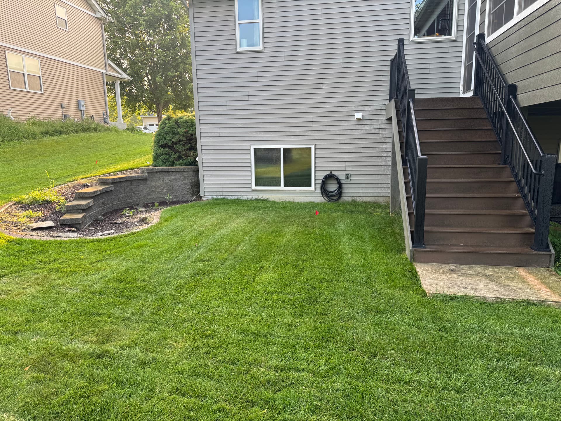 Backyard Transformation with Retaining Wall and Outdoor Kitchen in Lakeville