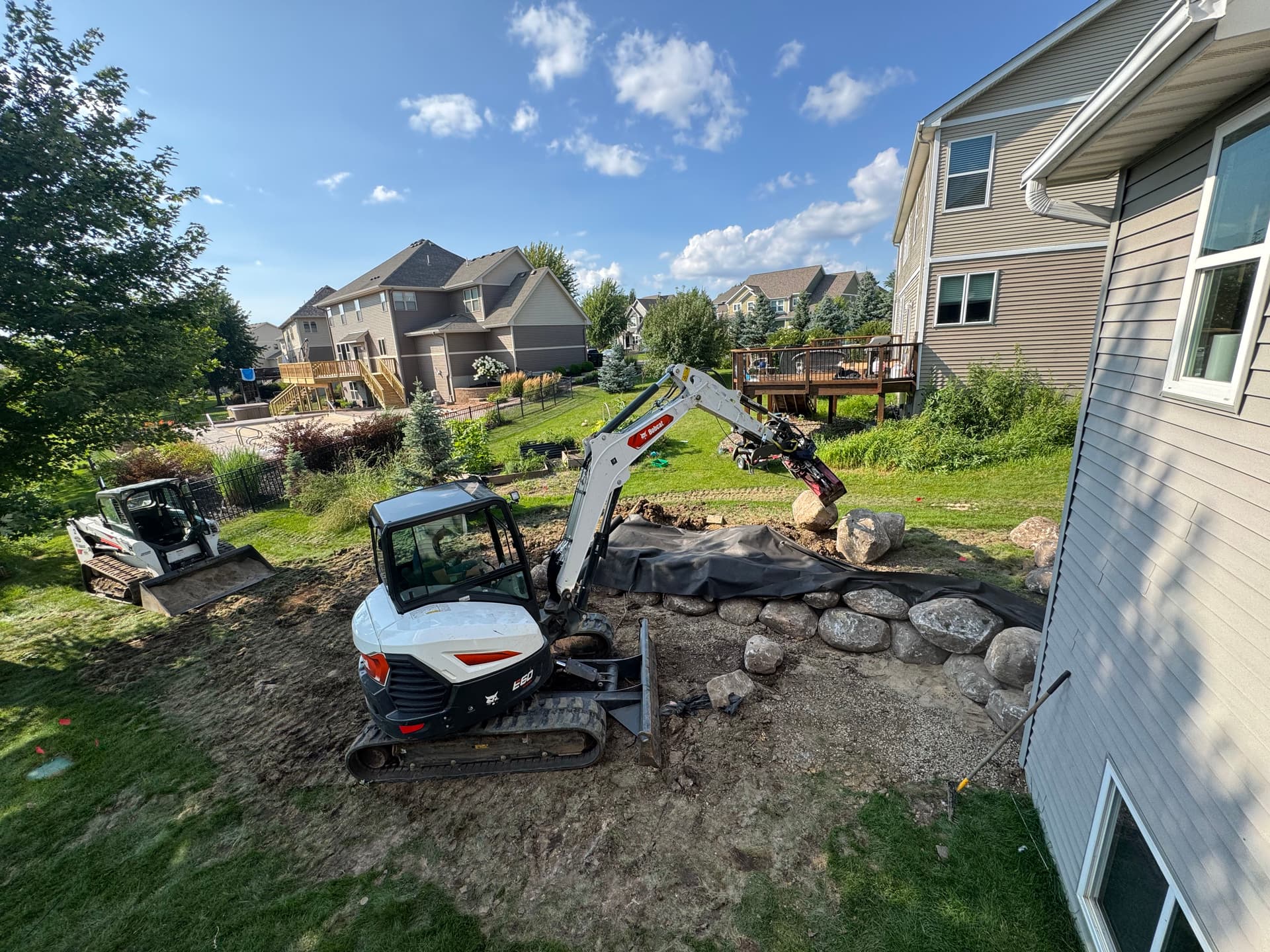 Backyard Transformation with Retaining Wall and Outdoor Kitchen in Lakeville