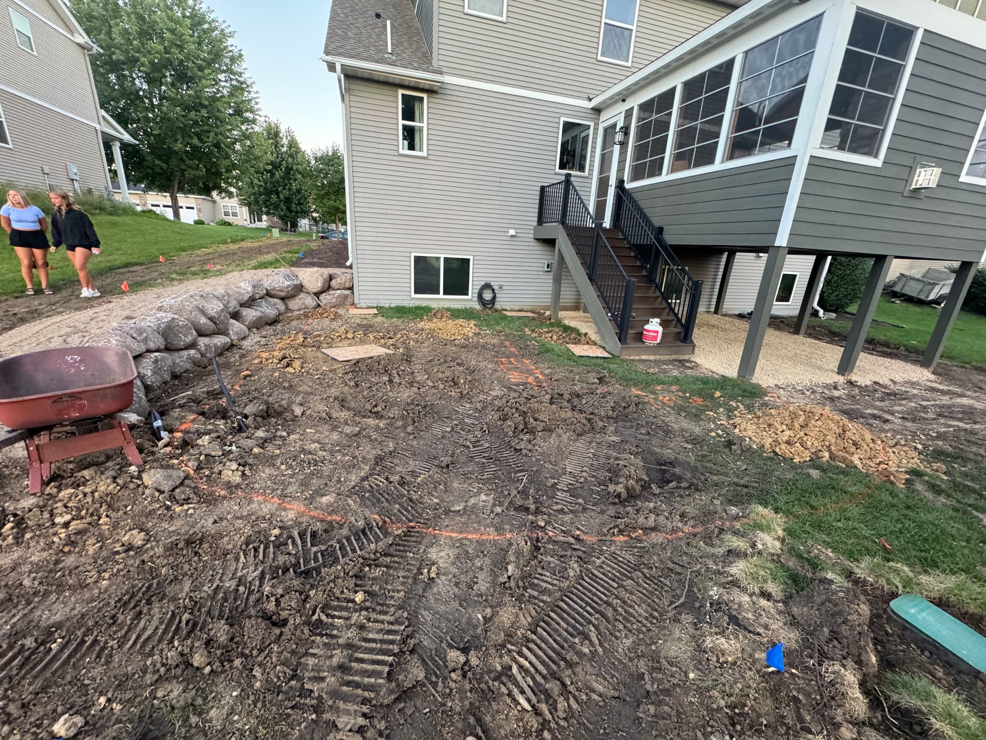 Backyard Transformation with Retaining Wall and Outdoor Kitchen in Lakeville