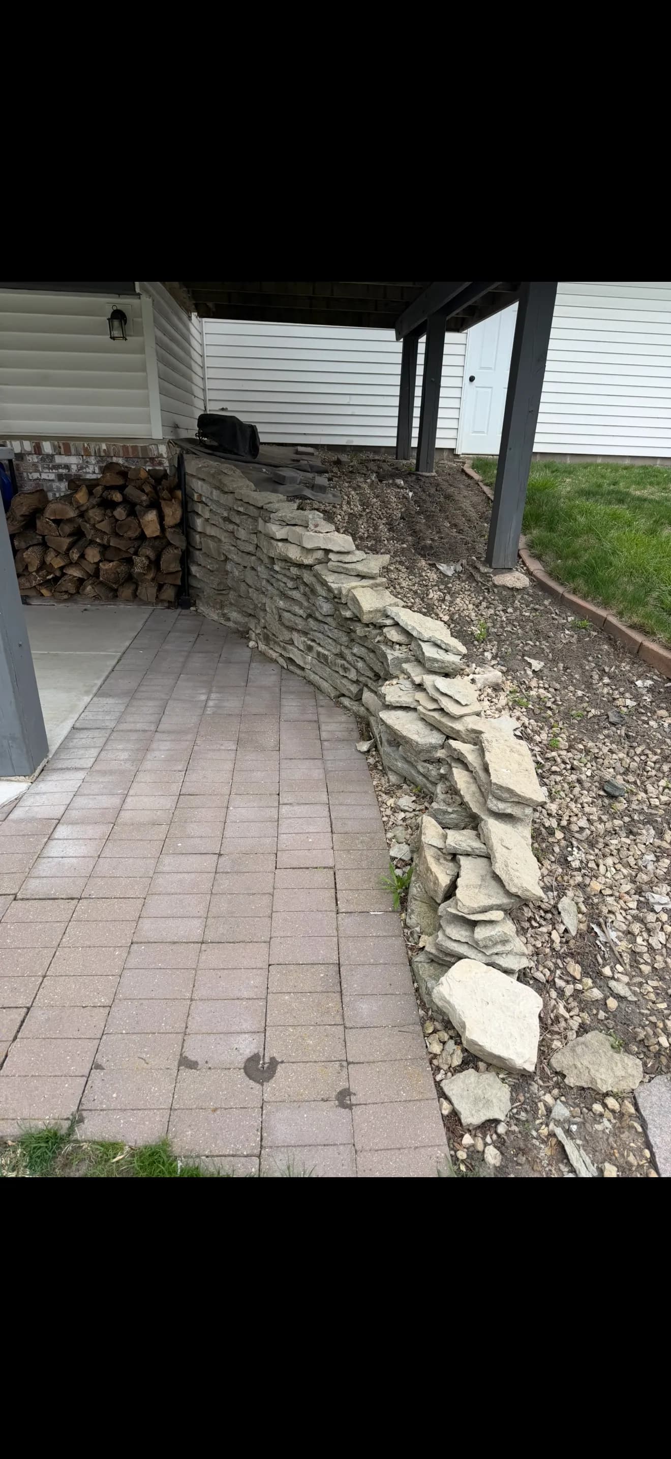 Failing Retaining Wall Gets a Full Rebuild with VERSA-LOK and New Paver Patio image